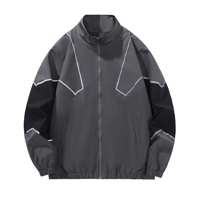 Gray and black style 6657 jacket full front with angular piping, stand collar, zip front and gathered cuffs and hem on white.
