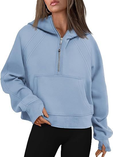 Ocean green pullover hoodie with zipper shown folded on neutral background

