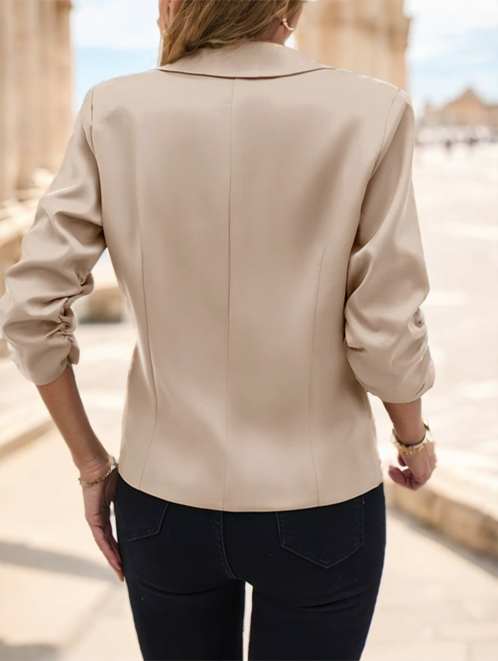 Office-ready women's blazer styled with jeans and heels

