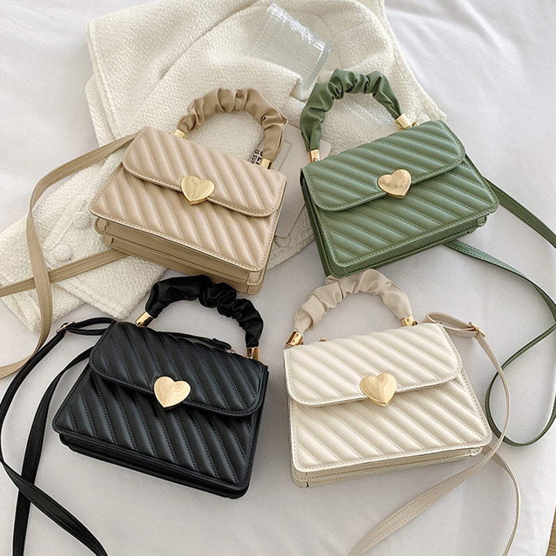 Outfit flatlay with women’s chain shoulder bag – modern look