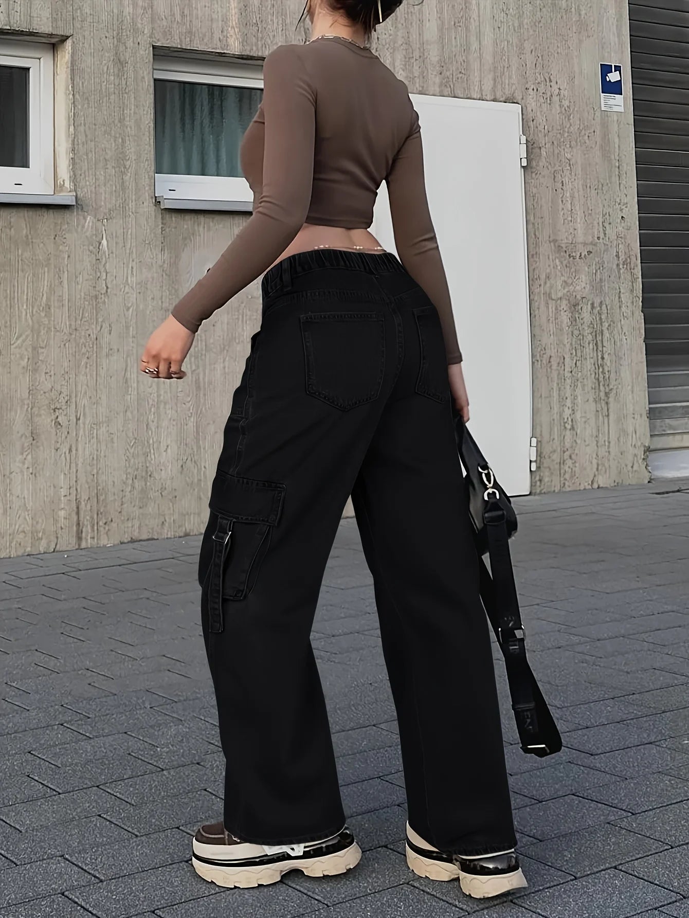 Overhead View of Flap Pockets on Women's Cargo Jeans for Trendy Storage Solutions