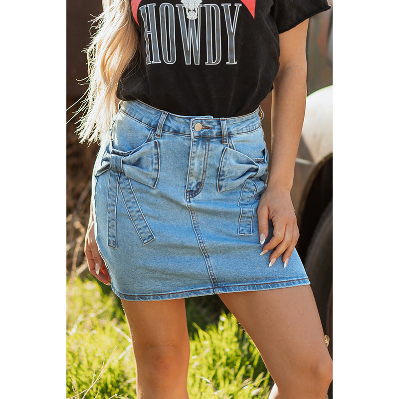“Pair your High Waist Denim Skirt with boots for an edgy look  -bow detail adds a feminine touch.”