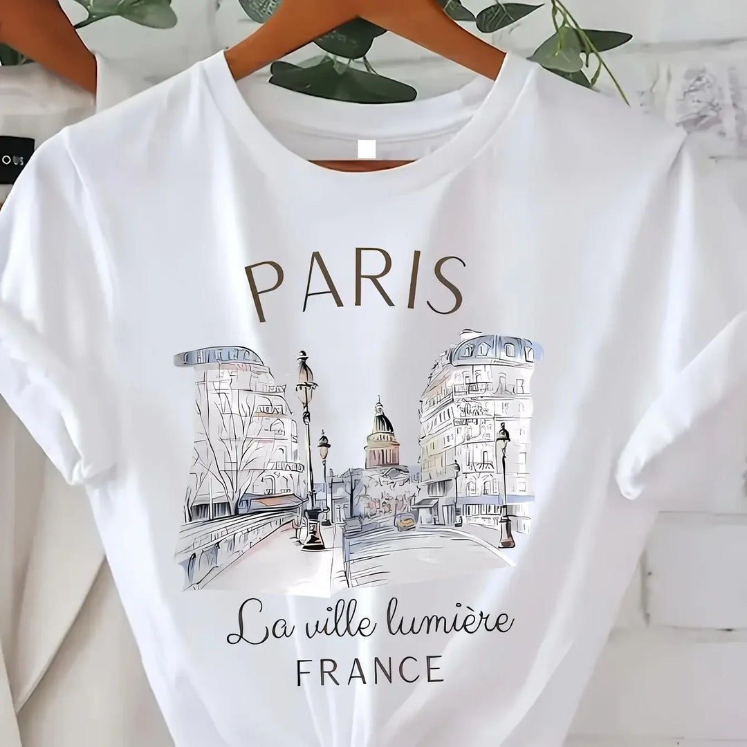 Paris T Shirt tucked into skirt – 90s graphic elevates city style