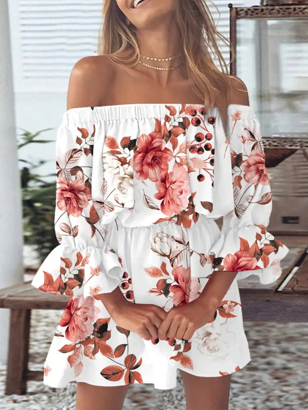 Close-up of vibrant floral print and ruffled sleeve detail on the plus size dress

