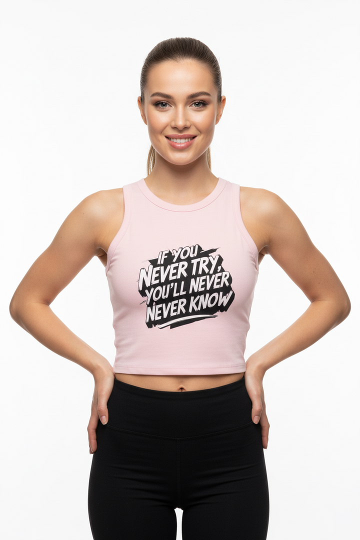 Side angle of motivational tank top styled with leggings in a bright studio