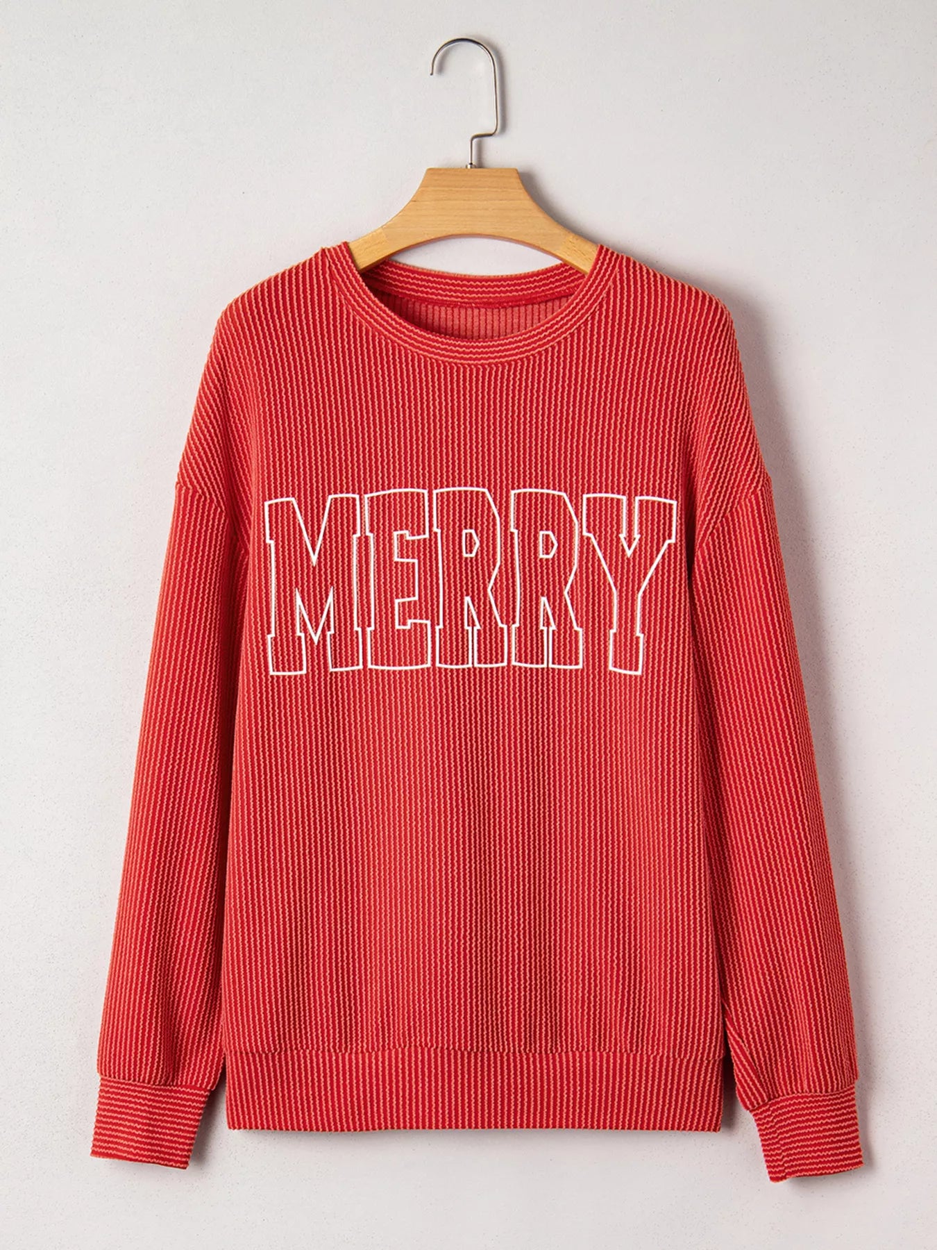 Ribbed Christmas top layered under coat – winter styling