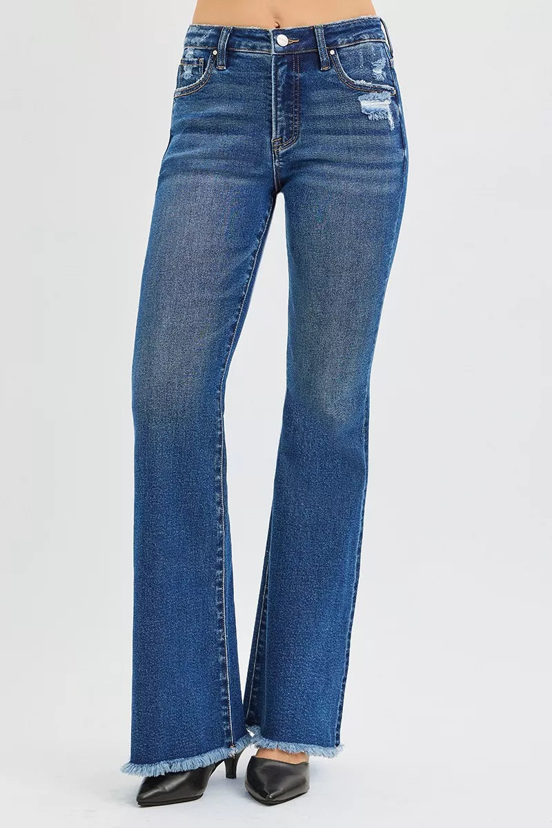 Risen high rise flare jeans raw hem close-up – clean fray