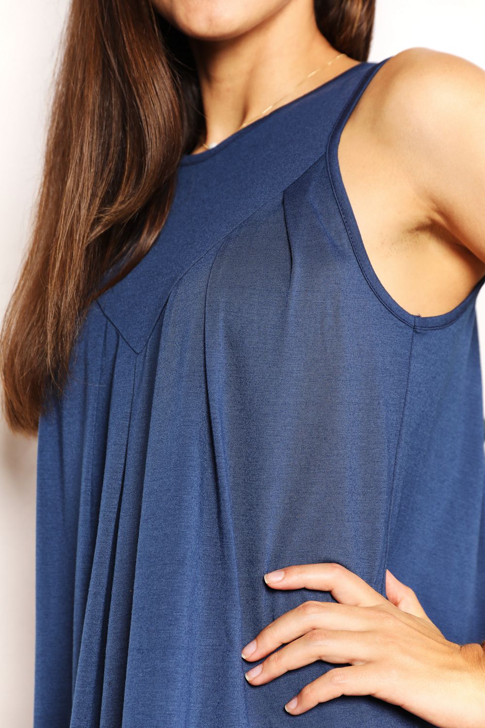 “Round Neck Sleeveless Mini Dress draped on a modern boutique mannequin”

