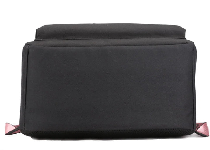 Bottom view of the plain black bag showing the flat rectangular base, black fabric, stitched seams and small pink strap ends.
