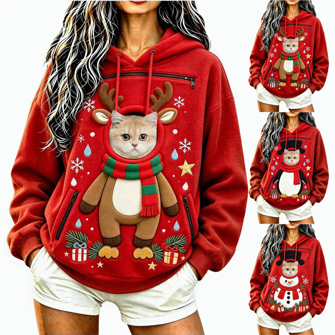 Cropped studio model in a red festive hoodie with a cat, showing three holiday prints, long sleeves and front pouch openings.