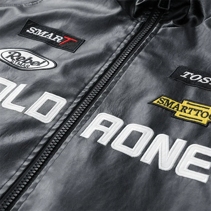 Black jacket chest lettering, patches and zipper detail