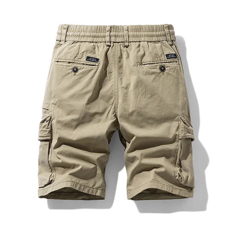 Original back view of khaki cargo shorts with an elastic waist and buttoned rear pockets.