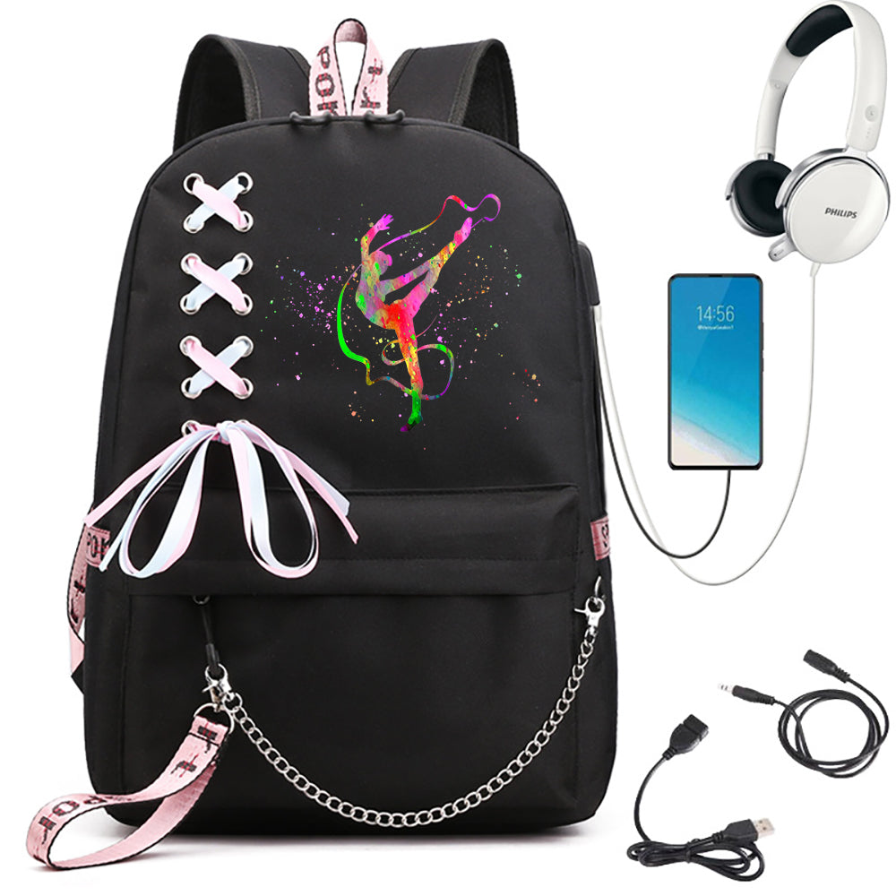 Black school backpack with rainbow ribbon gymnast artwork, light pink bow and pink webbing, beside phone and headphone props.
