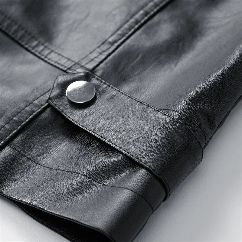 Close-up of black jacket snap fastener and seam