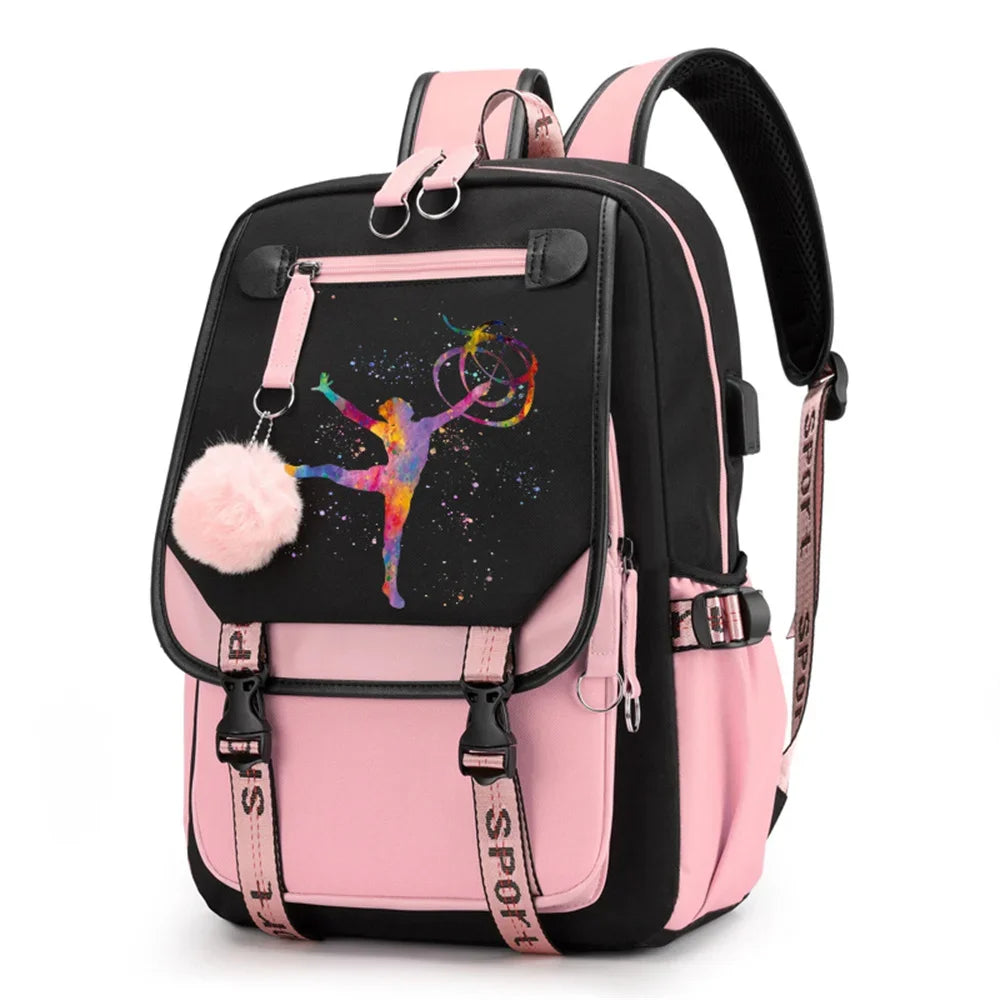 Pink and black backpack in design 1D-35-11 with a colorful gymnast print, buckle straps and pink pendant, shown against white