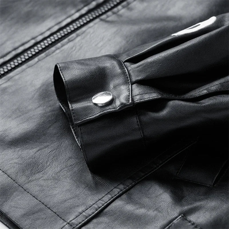 Close-up of black jacket cuff with snap