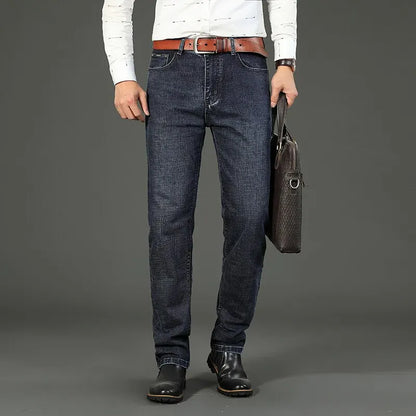 "business casual men's jeans dark blue stretch denim styled with shirt and blazer for work meeting"
