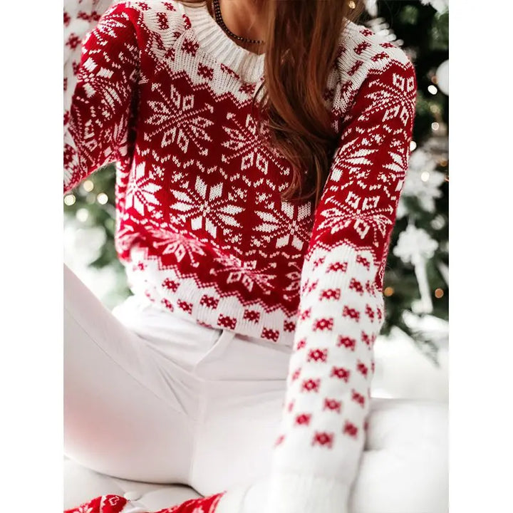Close view of the white-neck red snowflake sweater and sleeve pattern