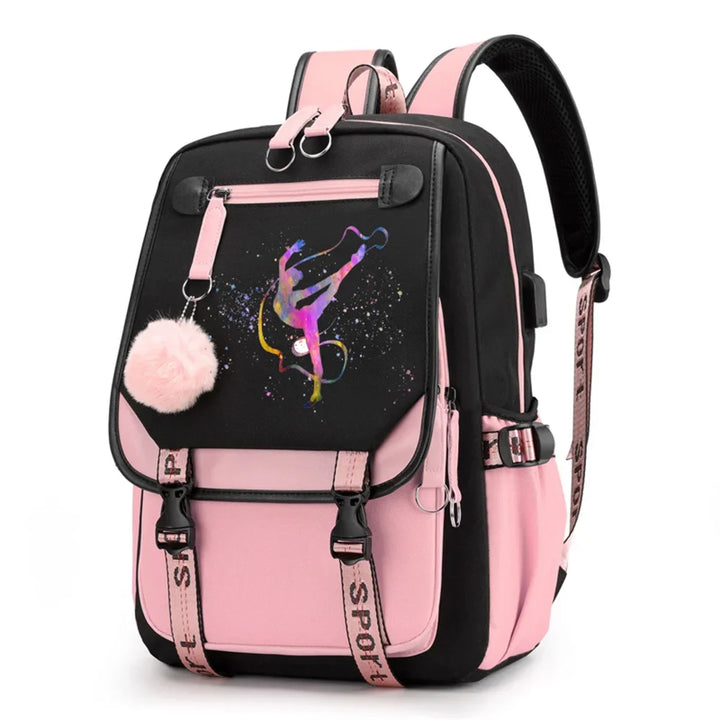 Pink and black backpack in design 1D-35-3 with a colorful gymnast print, buckle straps and pink pendant, shown against white.