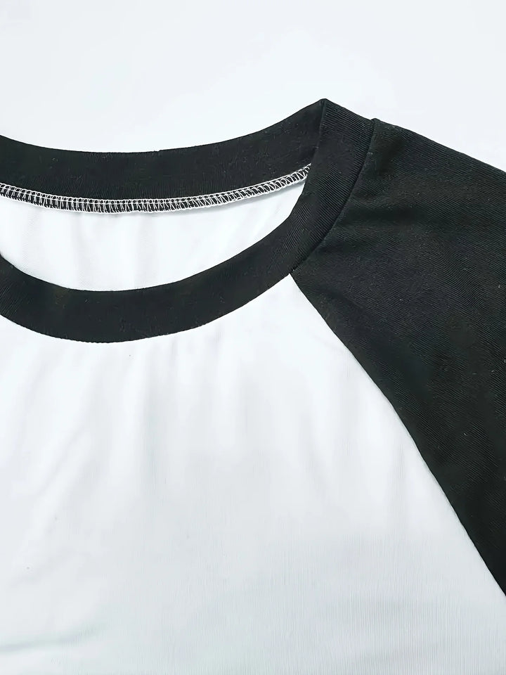 Original detail photo of the black neckline and raglan seam