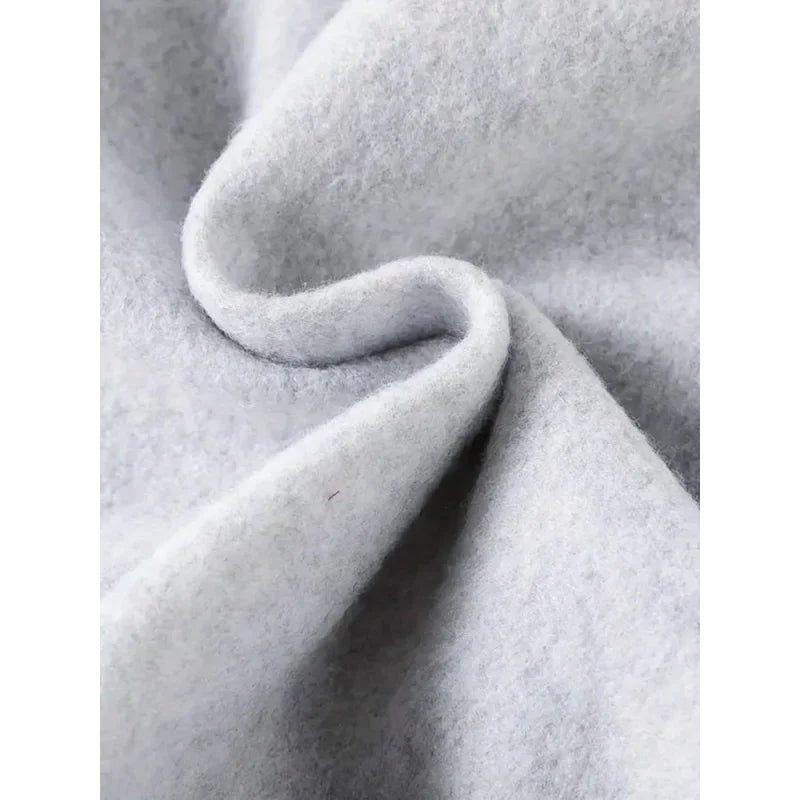 Women's oversized hooded sweatshirt side profile showing relaxed fit for layering