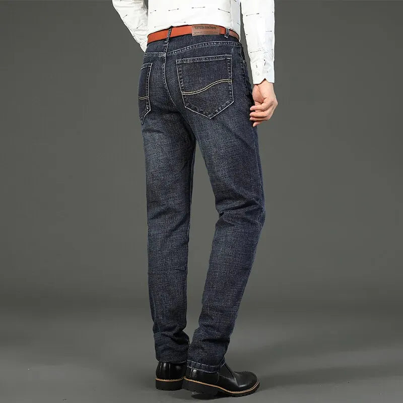 "men's stretch straight leg jeans close-up of zipper fly and pockets highlighting soft midweight denim"