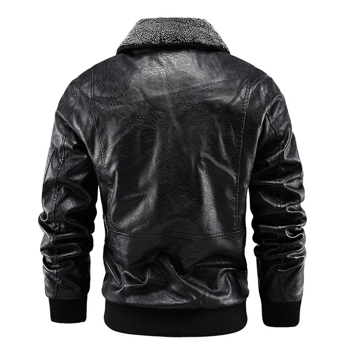 Black jacket rear view with a plain back, shoulder seams, textured collar and ribbed hem.
