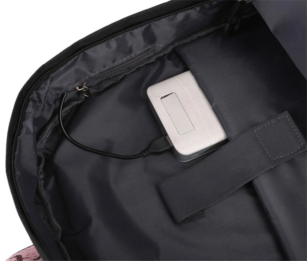 Interior connection cable in black reference school backpack, shown with an external power bank as a demonstration in detail.