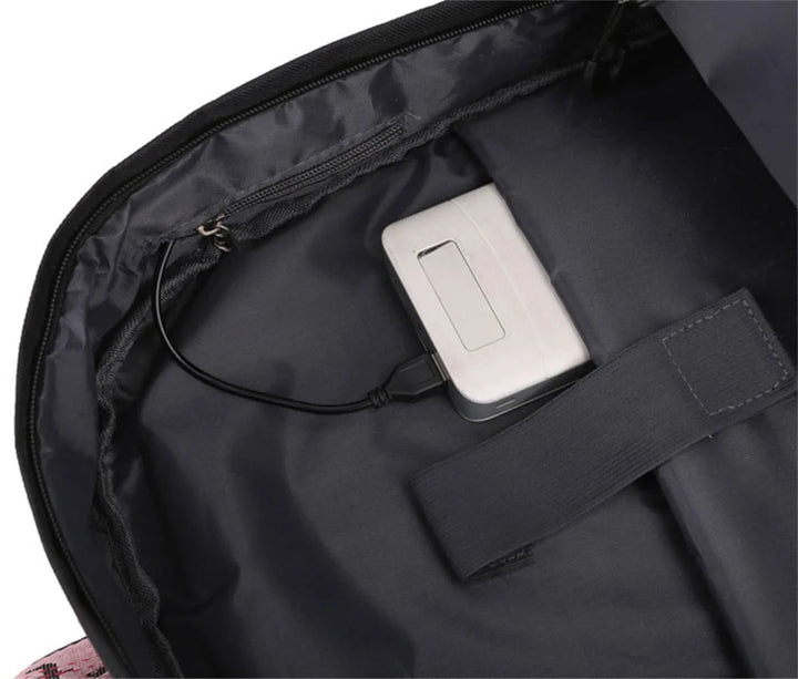 Interior USB cable routing reference inside the black bag with a power bank shown; included power accessories are unverified.