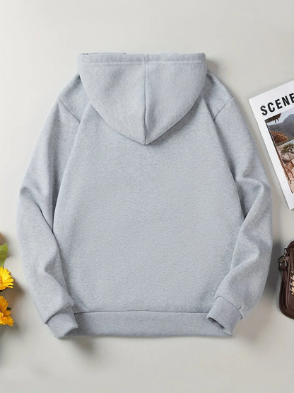 Women's oversized hooded sweatshirt London print side angle casual fall outfit layering