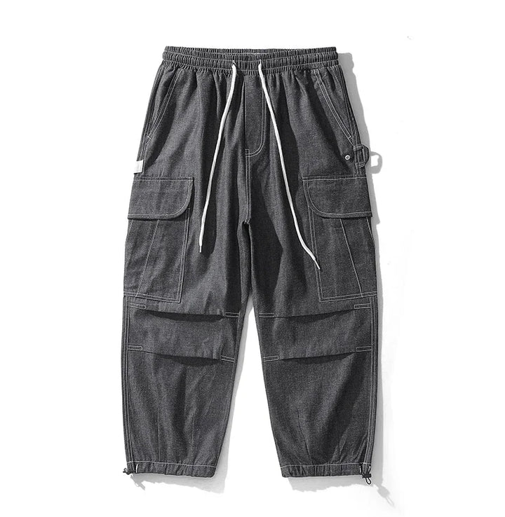 Original front view of black cargo joggers with white drawstrings and contrast stitching.