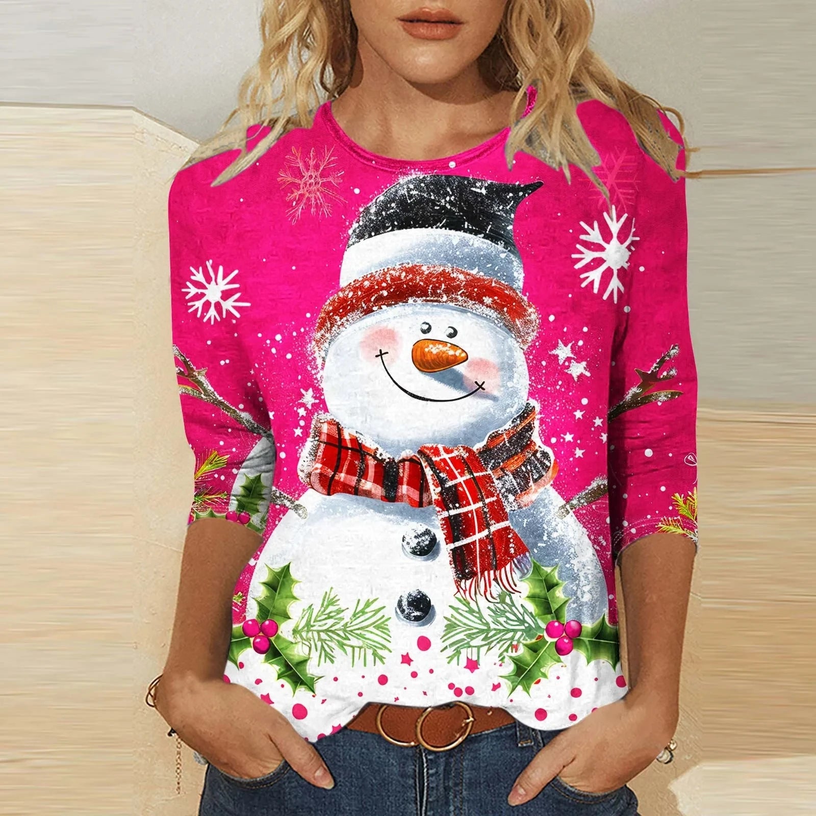 womens festive holiday snowman shirt relaxed fit top styled with santa hat and mug of hot cocoa by the tree