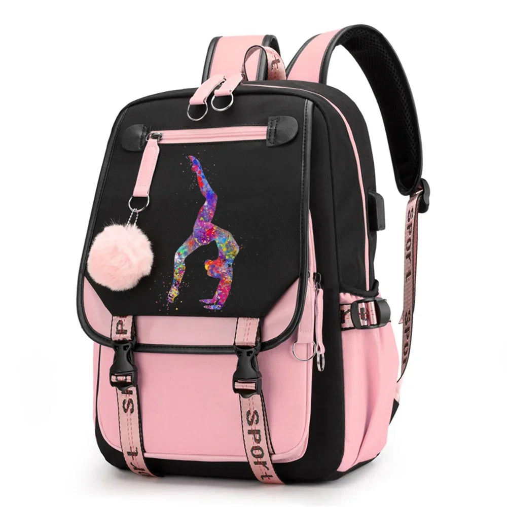 Pink and black backpack in design 1D-35-18 with a colorful gymnast print, buckle straps and pink pendant, shown against white