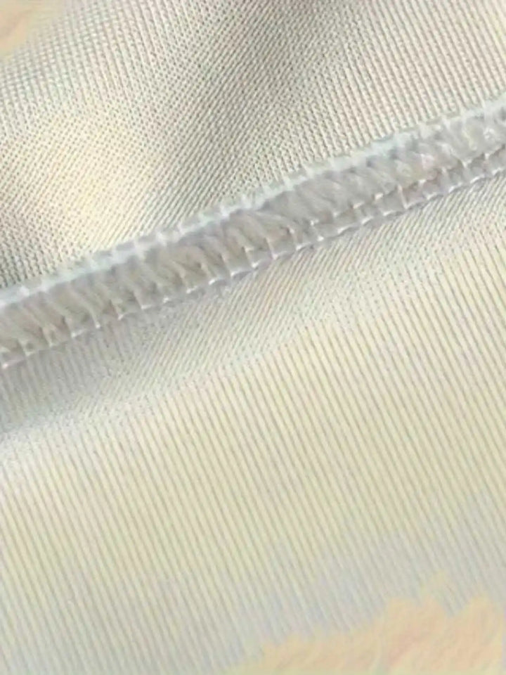Close view of light-colored fabric stitching and seam detail