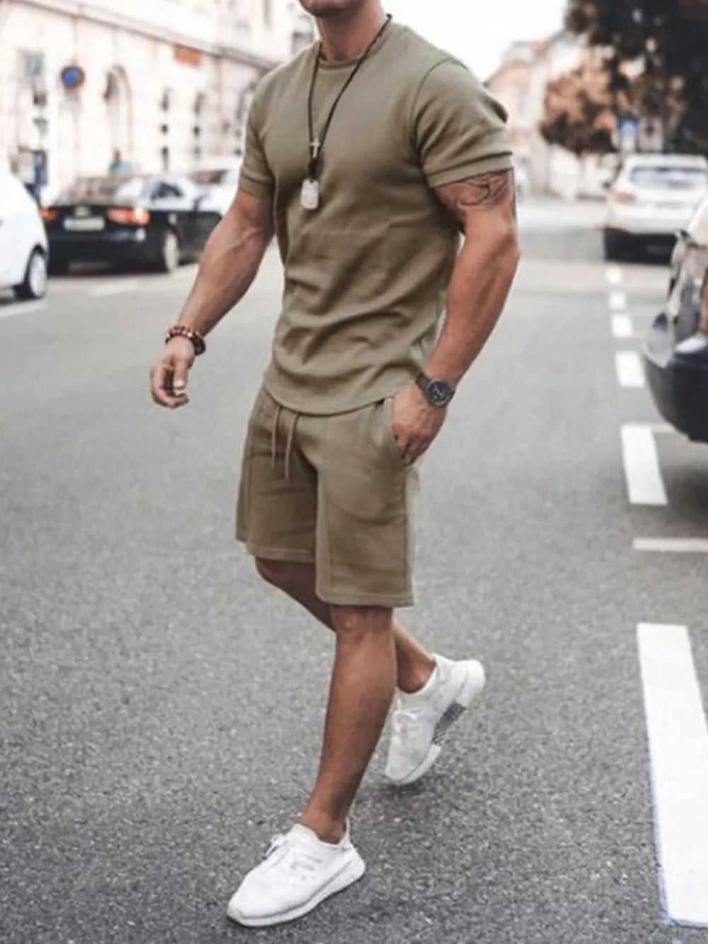 Two-piece set for men shown with sneakers

