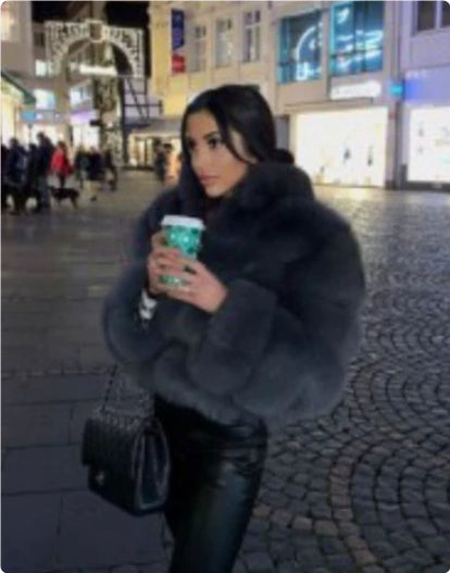 Side View of Long-Sleeve Women's Faux Fur Coat in Soft Gray – Perfect for Temperament Commuting Looks