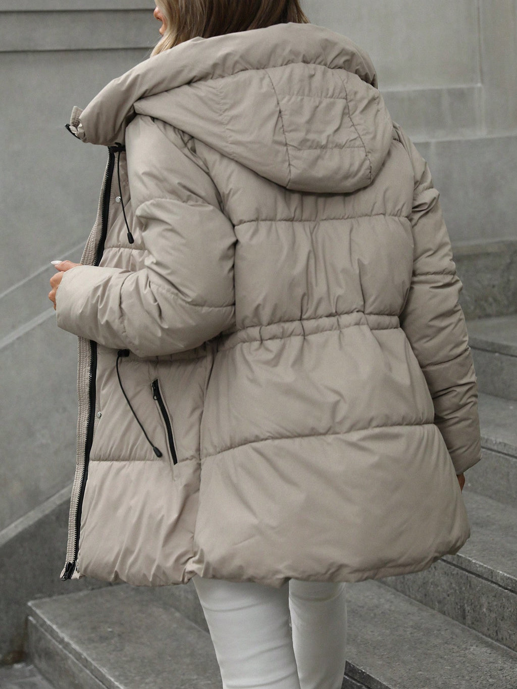 “Side profile highlighting the mid-length cut and sleek silhouette, perfect over dresses or jeans.”

