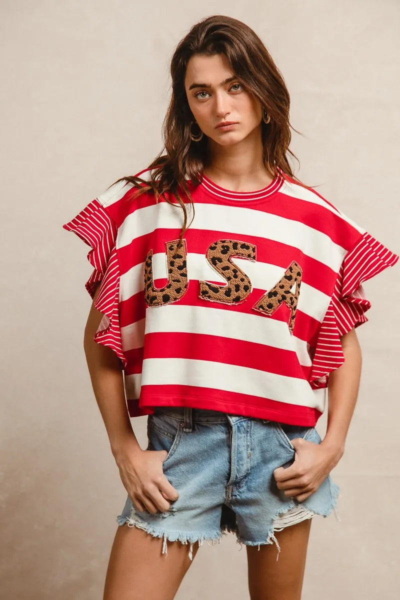 Side profile of casual BiBi top in urban setting.

