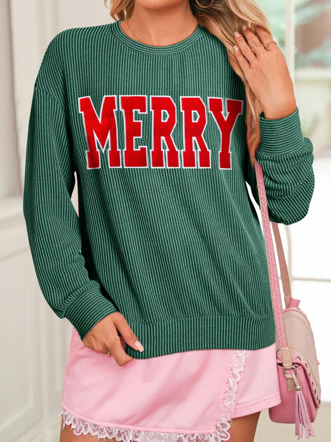 Side profile ribbed Christmas top styled with jeans – relaxed fit