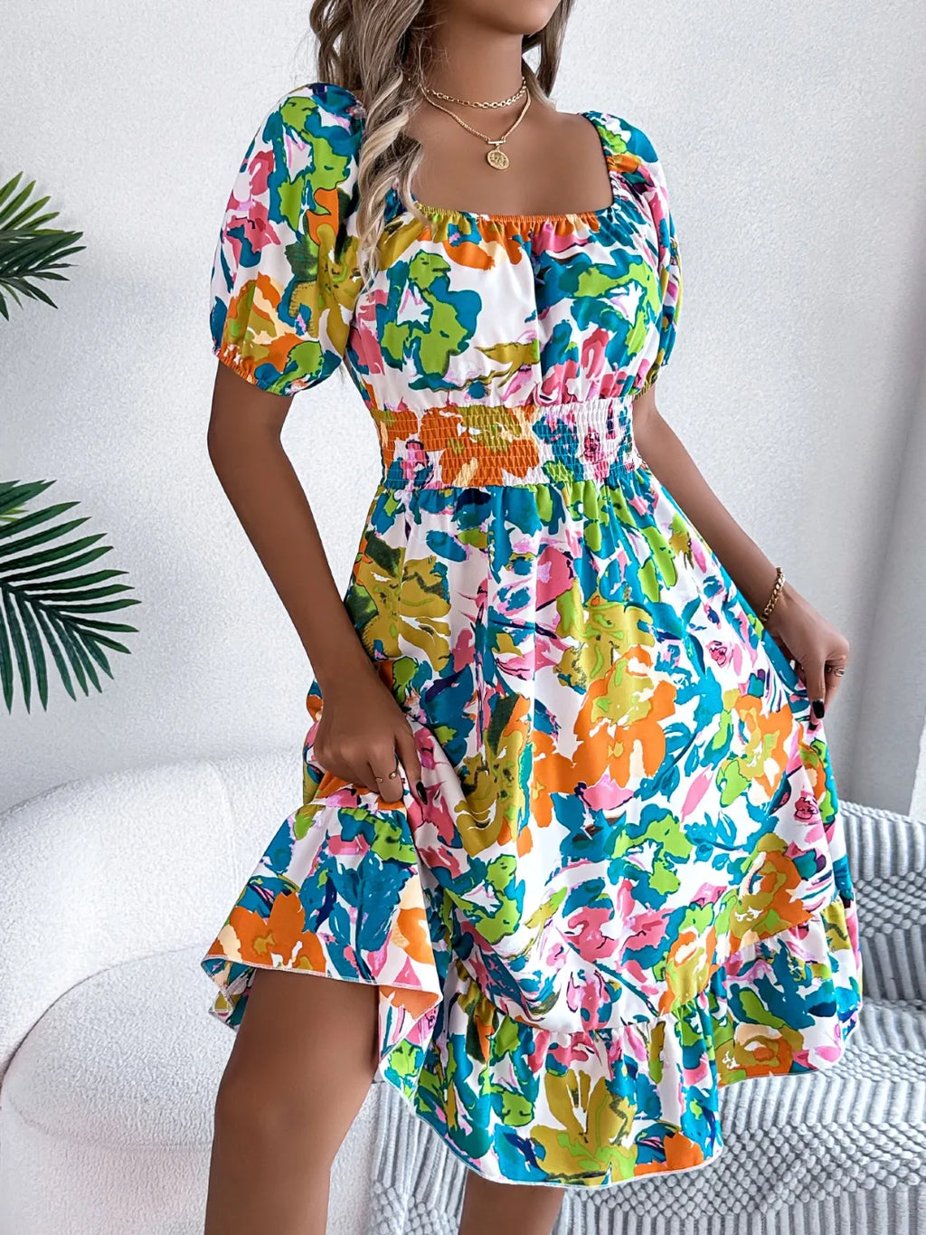 Sitting at a café in the soft, flowy smocked summer dress


