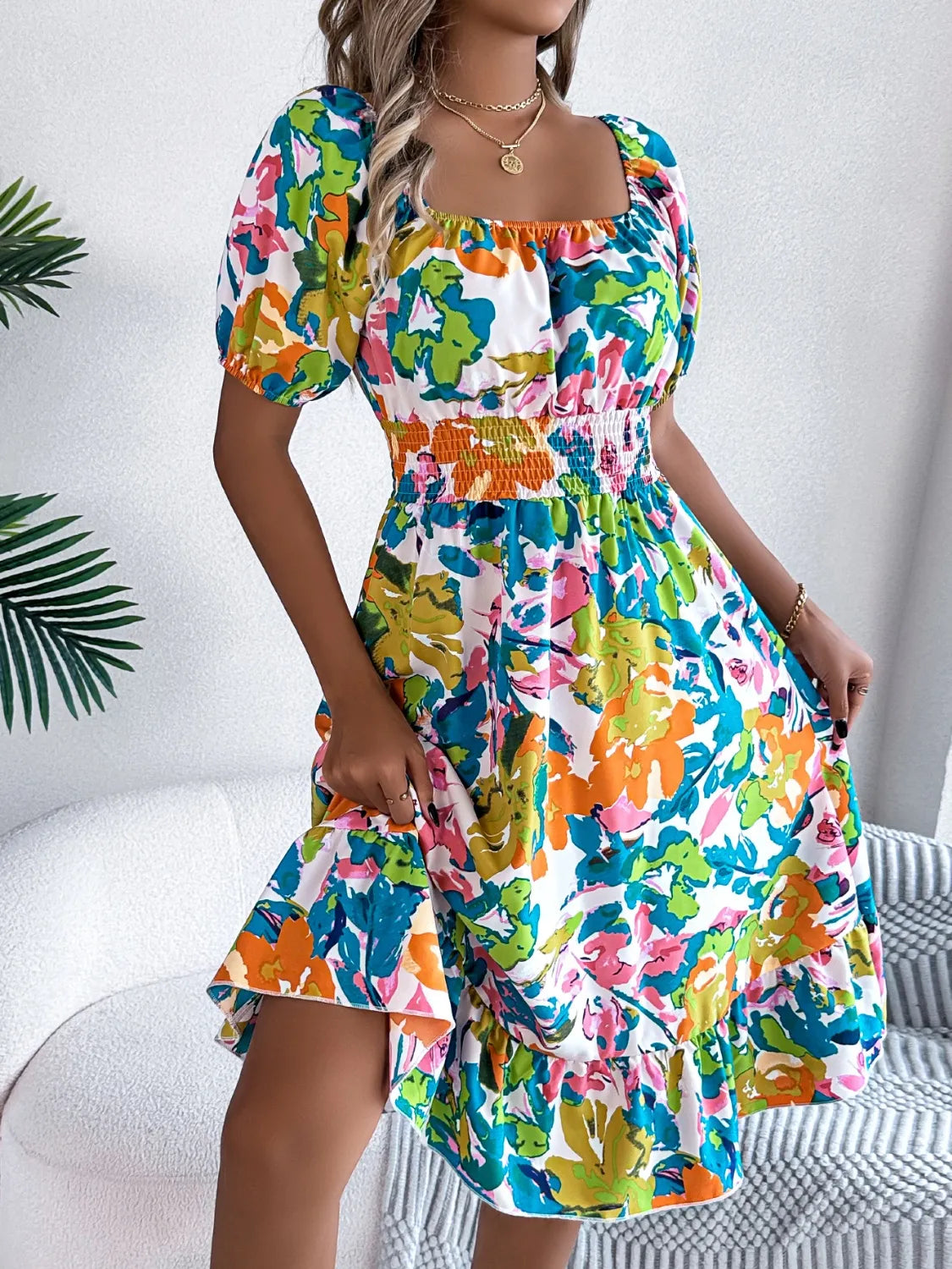 Sitting at a café in the soft, flowy smocked summer dress


