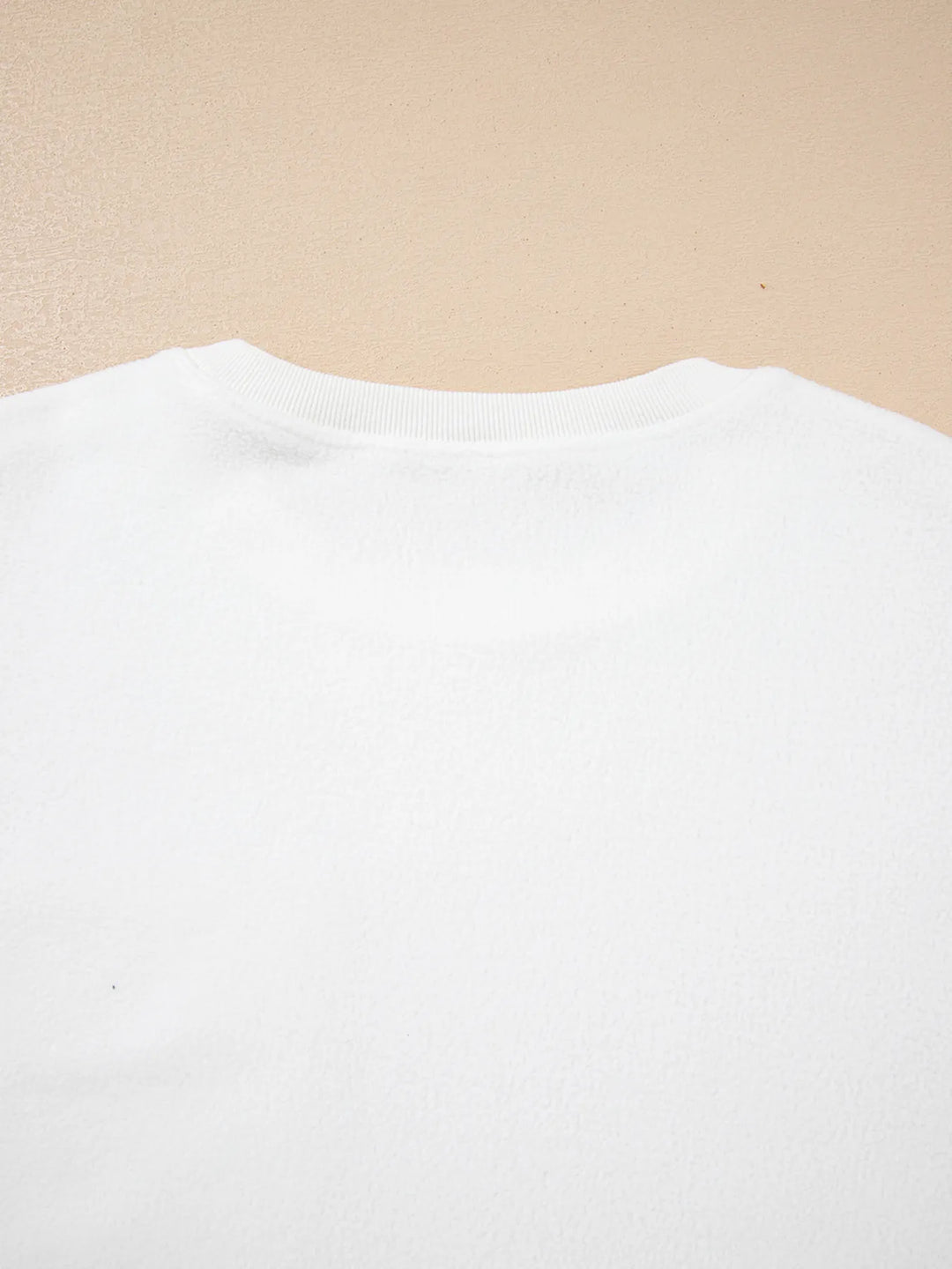 Soft and slightly stretchy top with exposed seam accents

