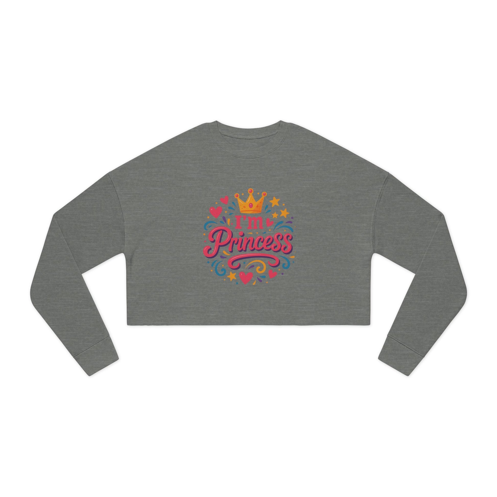 Refined cropped sweatshirt styled indoors with soft throws and candles

