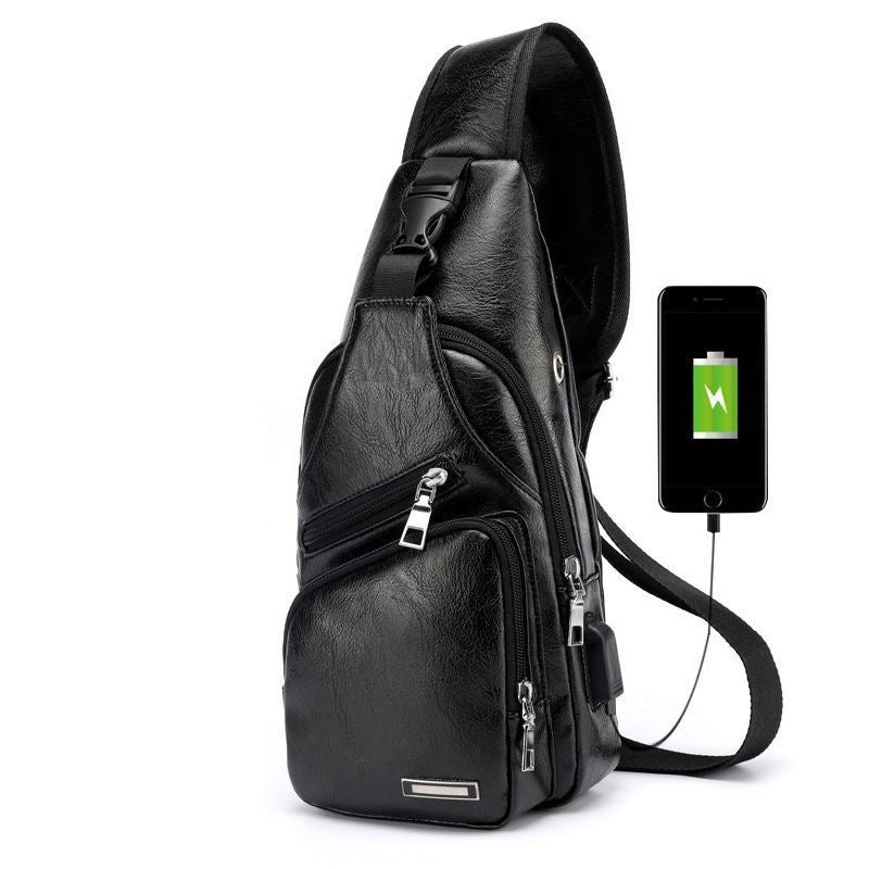 The spacious main compartment of the waterproof messenger bag, neatly organizing a tablet, wallet, and other essentials.

