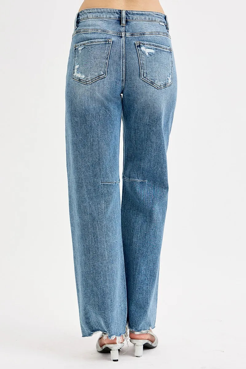 Tie-washed wide leg jeans – seated pose showing baggy leg