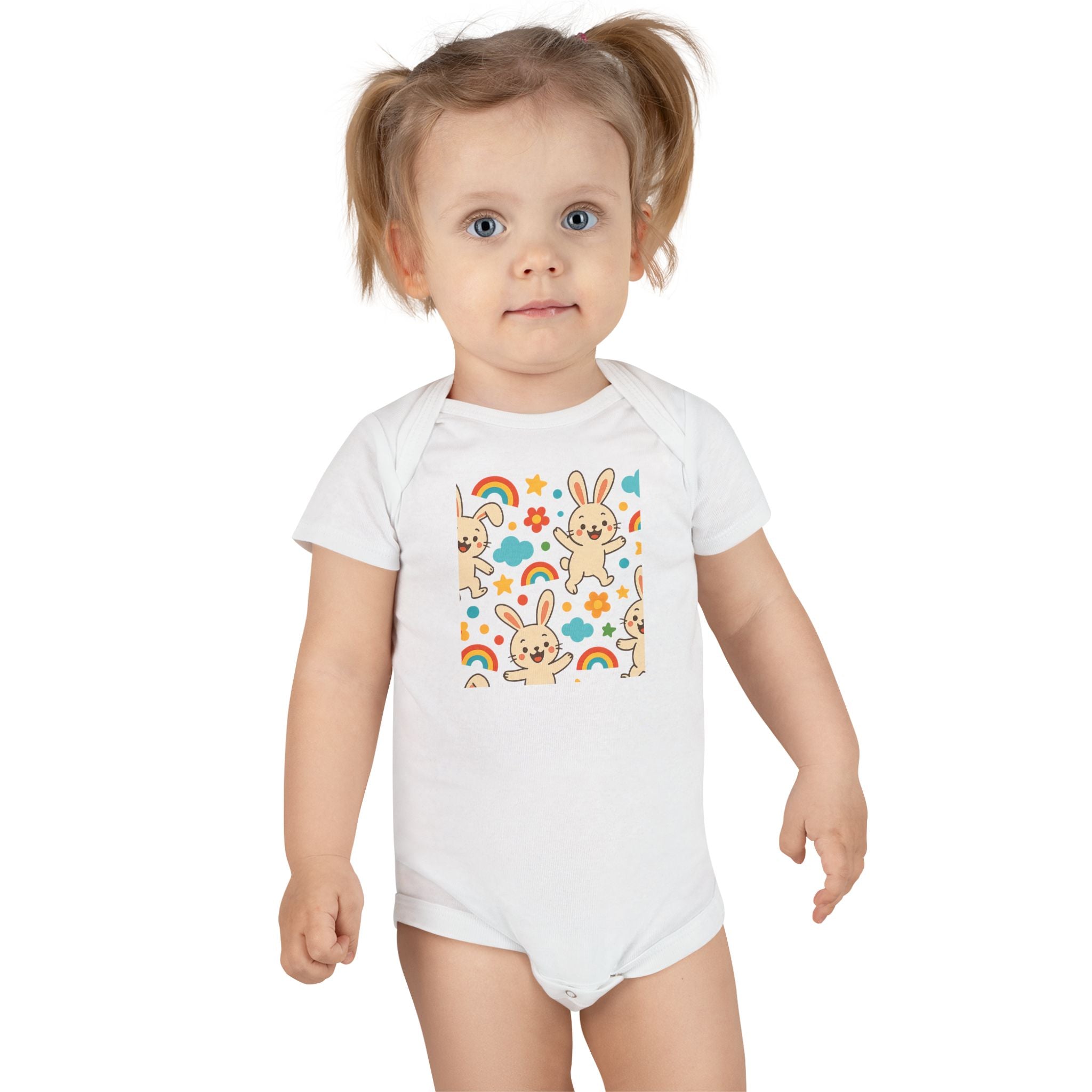 Close-up of cute bunny baby onesie print featuring cheerful bunnies and rainbows

