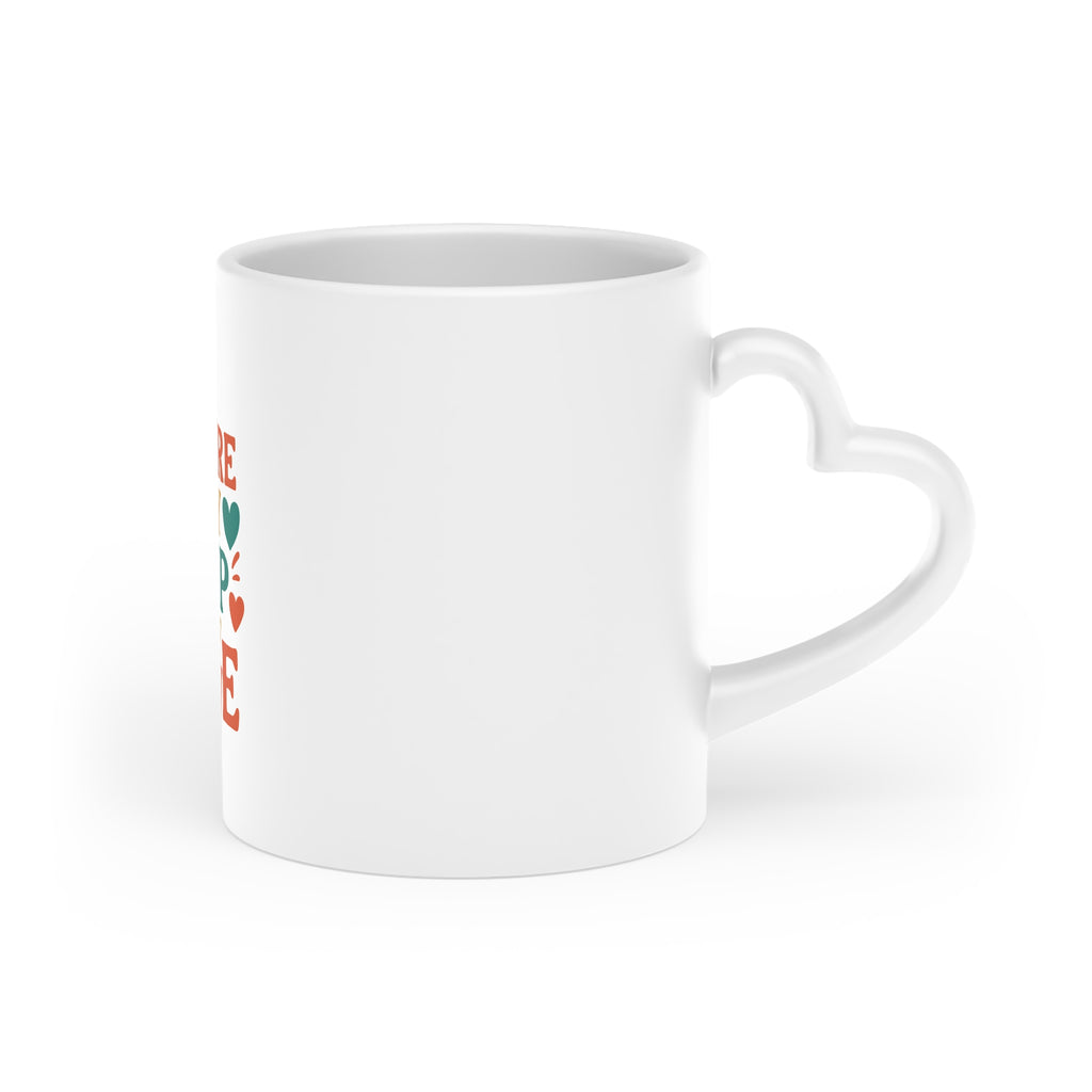 Unique heart-shaped ceramic mug on office desk


