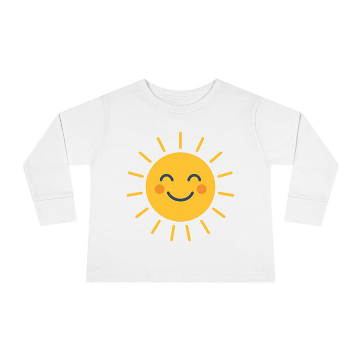 Unisex Sunny Smile Toddler Long Sleeve Tee styled with denim shorts for a fun family outing

