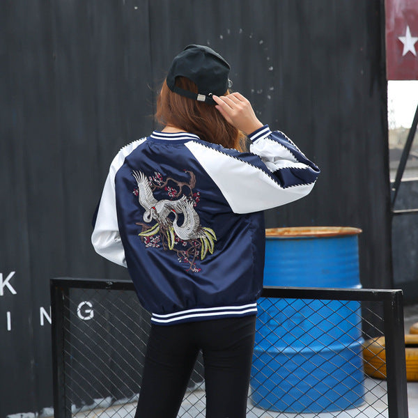 Urban winter outfit idea with embroidered baseball jacket


