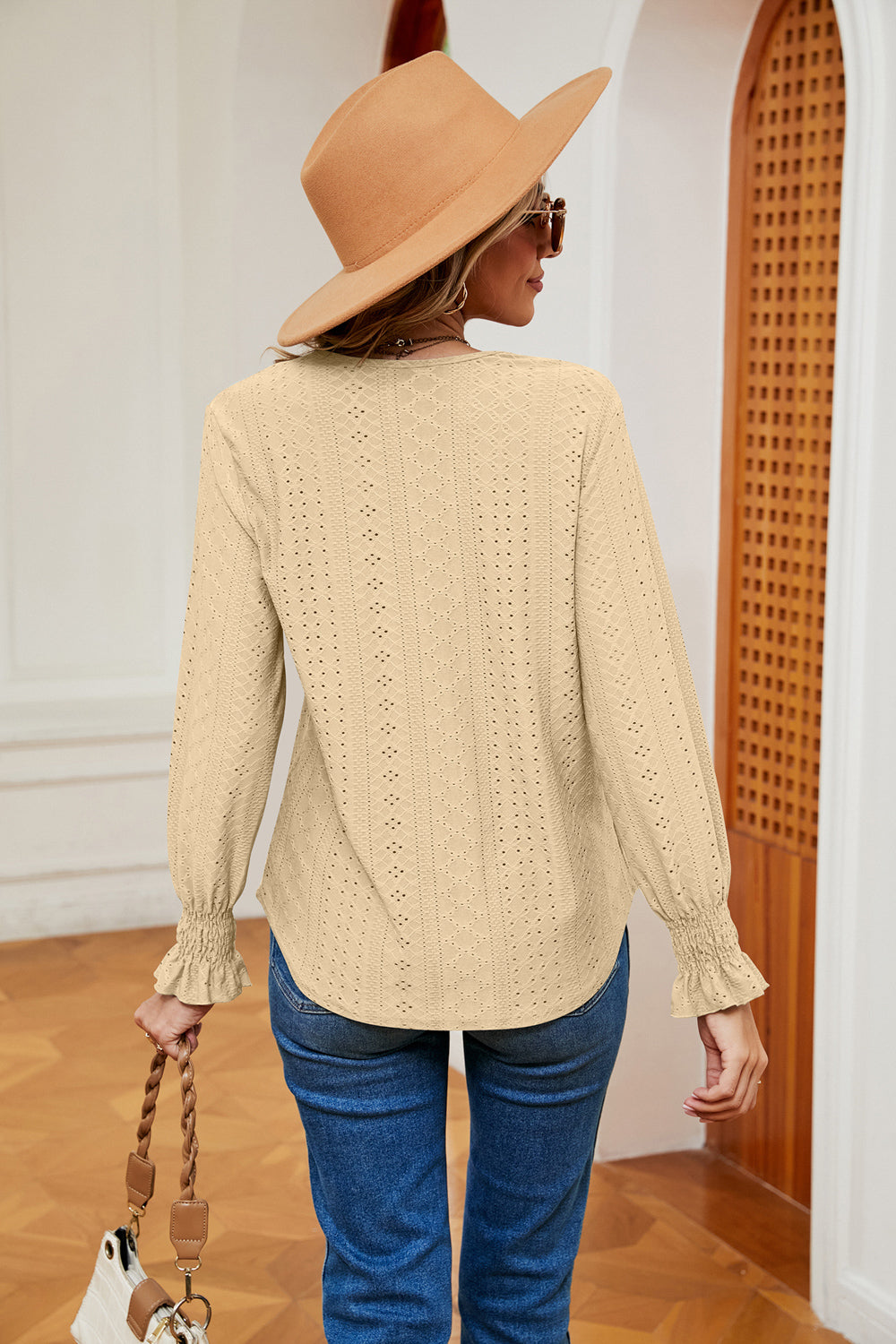 “White women’s blouse with contrast flounce long sleeves in a lightweight stretch rayon blend.”







